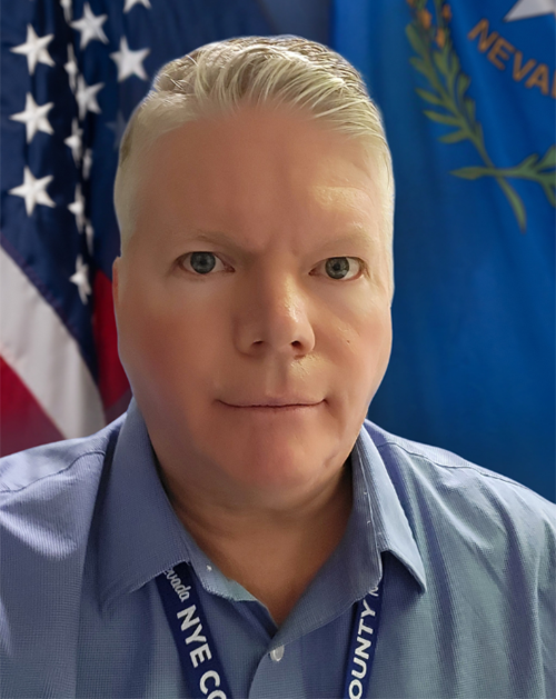 Planning Director Steve Osborne official county photo with the backdrop of the U.S. and State flag